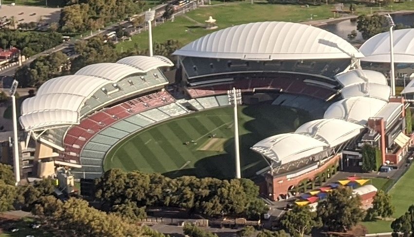 Aerial view of Adelaide Oval with its roofed stands, northern hill and cricket field