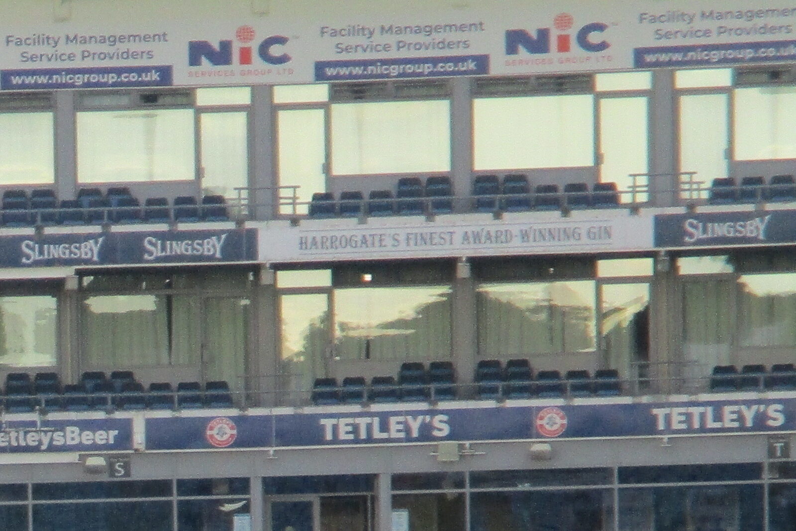 Glazed rooms and rows of empty balcony seats on Headingley’s East Stand.