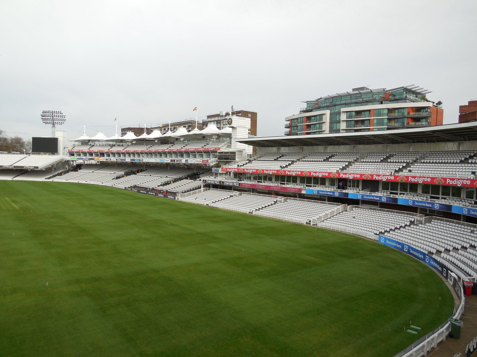 Empty Tavern Stand on the right and Mound Stand on the left at Lord’s, photographed across the outfield in April 2013